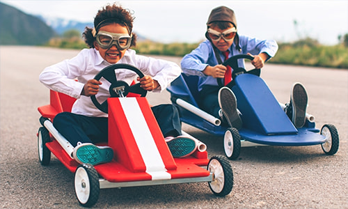 Children driving go-karts