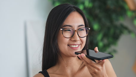 Woman talking on speakerphone