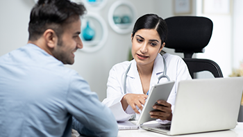 Female doctor talking to a patient