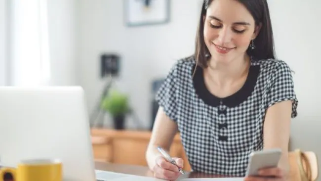 Woman smiling while working