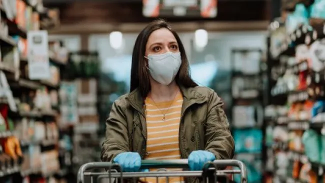 A woman with a facemask in a store