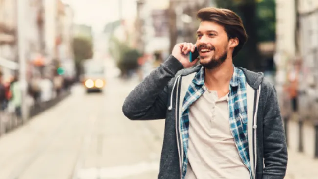 A man talking to someone over the phone