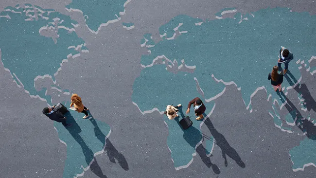 Group of people standing over world map