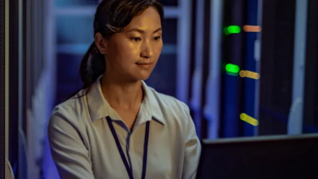 Woman working inside a data center