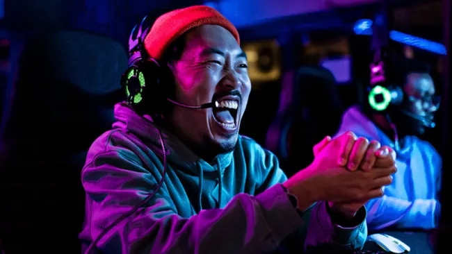 Excited man playing a video game