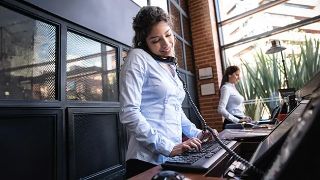 Woman answering the phone in a workplace