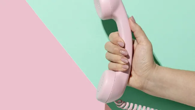 holding telephone