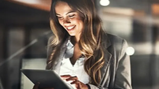 Woman working on a tablet in the office