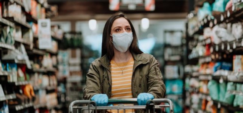 A woman with a facemask in a store