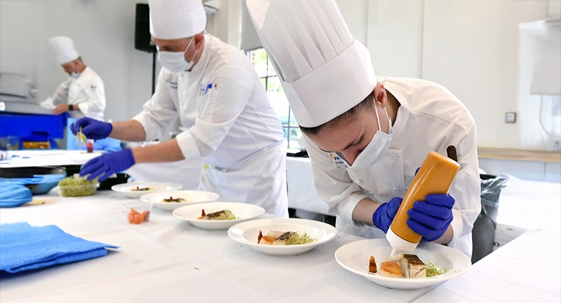 Chefs plating food 