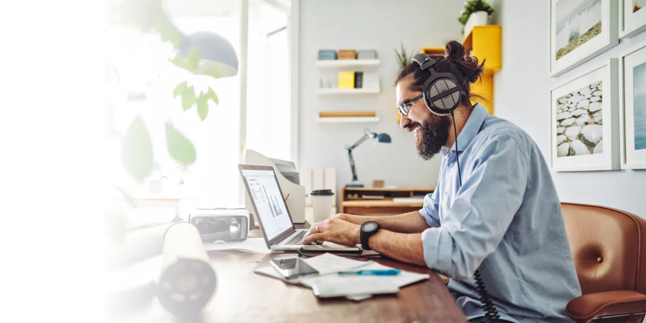 Man working on his laptop in his home office