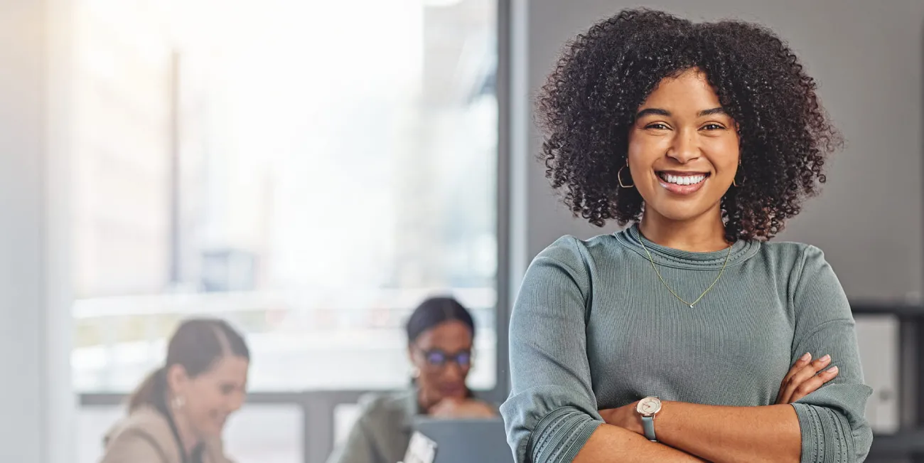 Woman in meeting room smiling at camera