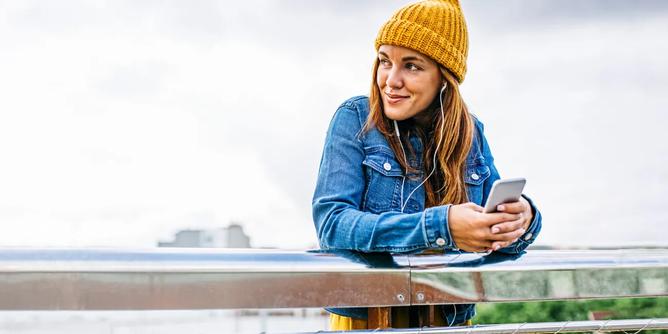 Woman standing on bridge over water