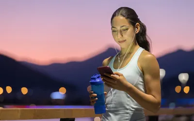 Woman in mountains looking at her phone