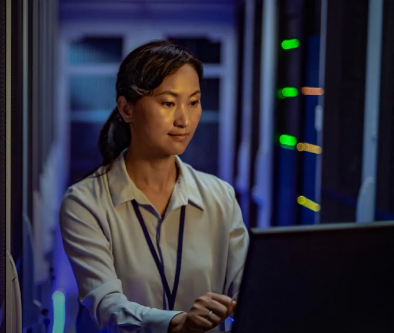 Woman working inside a data center