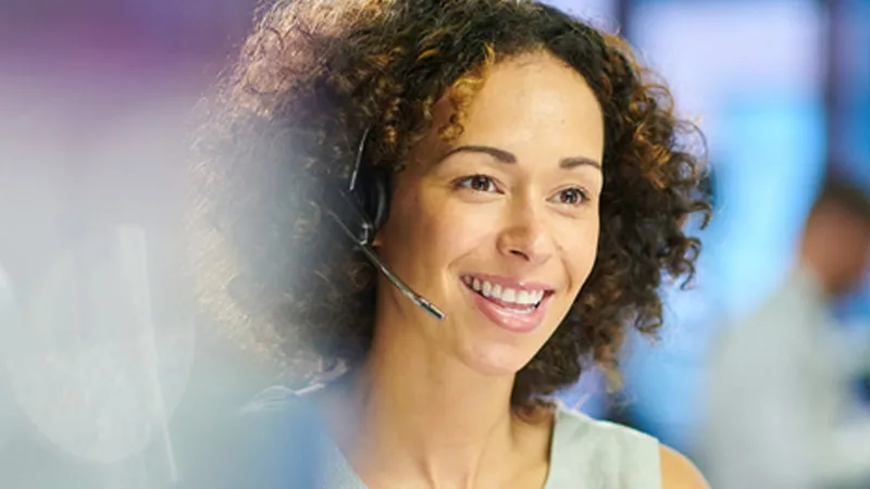 Contact center associate wearing a headset