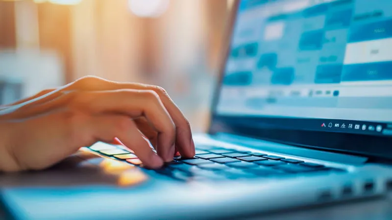 Person typing on a laptop