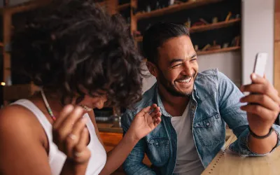 Two people giggling