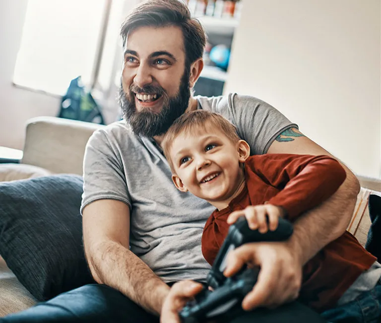 Man and son playing a video game