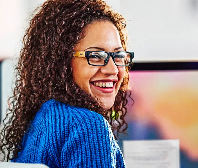 Woman smiling while sitting in office chair