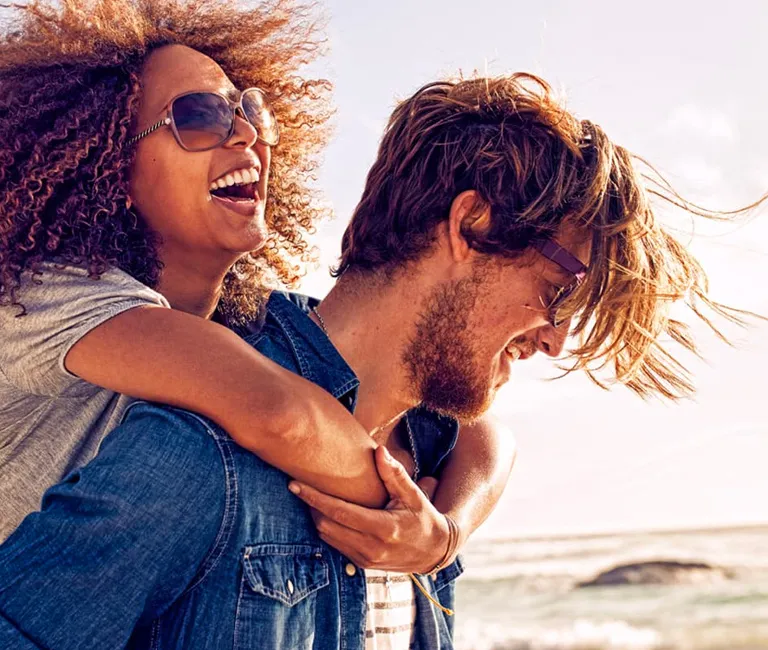 Man and woman walking on beach