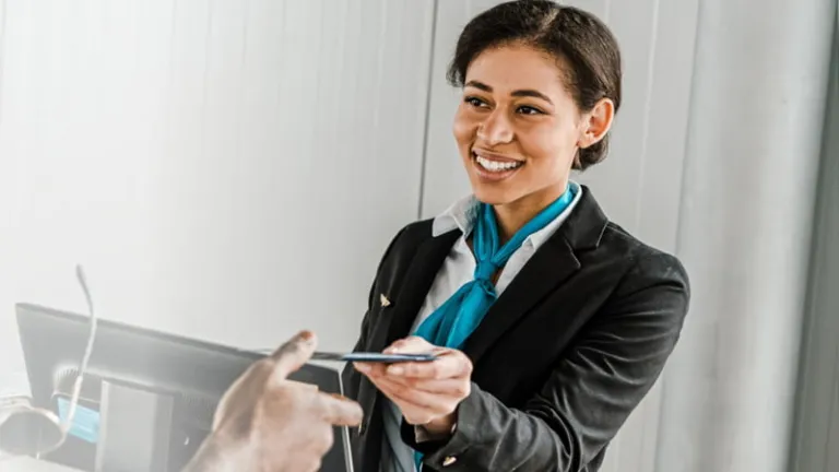 Airline associate helping a customer