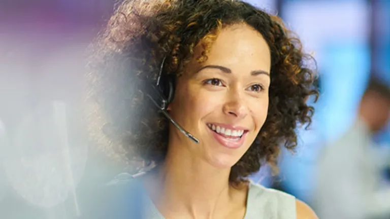 Contact center associate wearing a headset