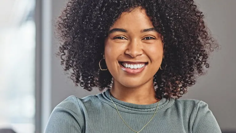 Woman smiling while looking into camera