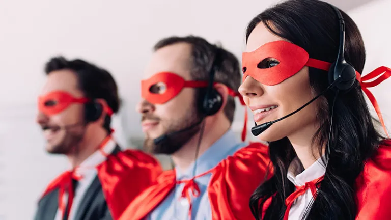 Call center associates dressed as super heroes